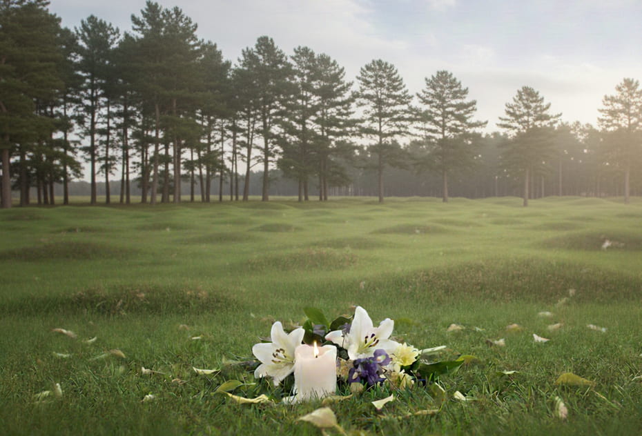 Outdoor memorial scene with a candle and flowers for Santa Rosa, CA funeral home and cremations