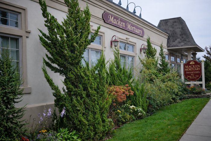 Macken Mortuary exterior with landscaped gardens representing Island Park, NY funeral home and cremations services