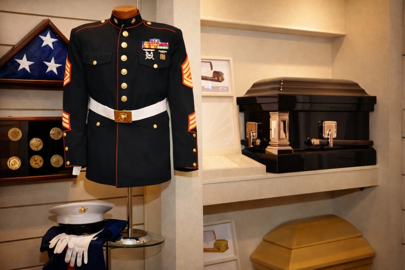 Military memorial display with Marine uniform and folded flag highlighting Long Beach, NY veteran services